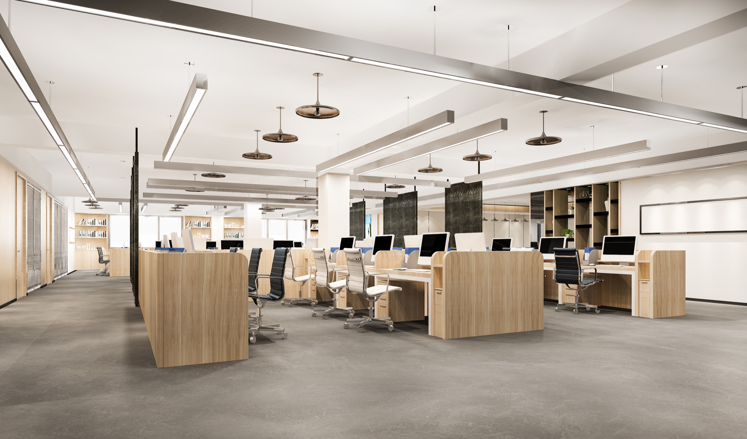 A modern open-plan office with timber workstation pods, ergonomic seating and layered pendant lighting